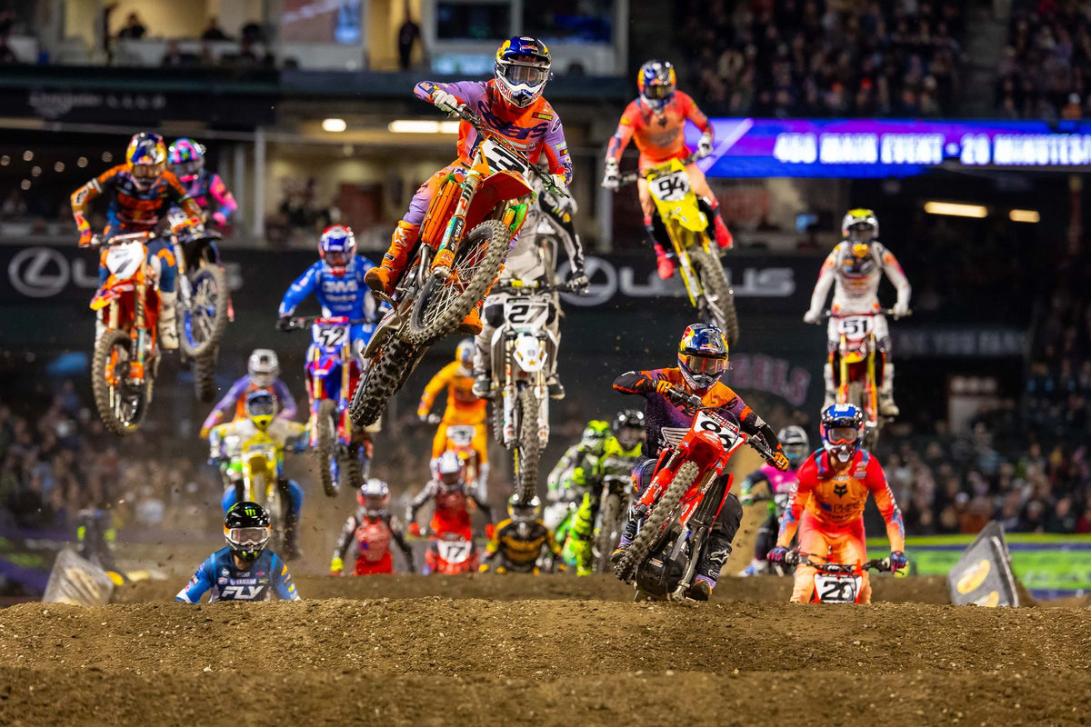 450SX riders launching over the start jump at Angel Stadium during an AMA Supercross race